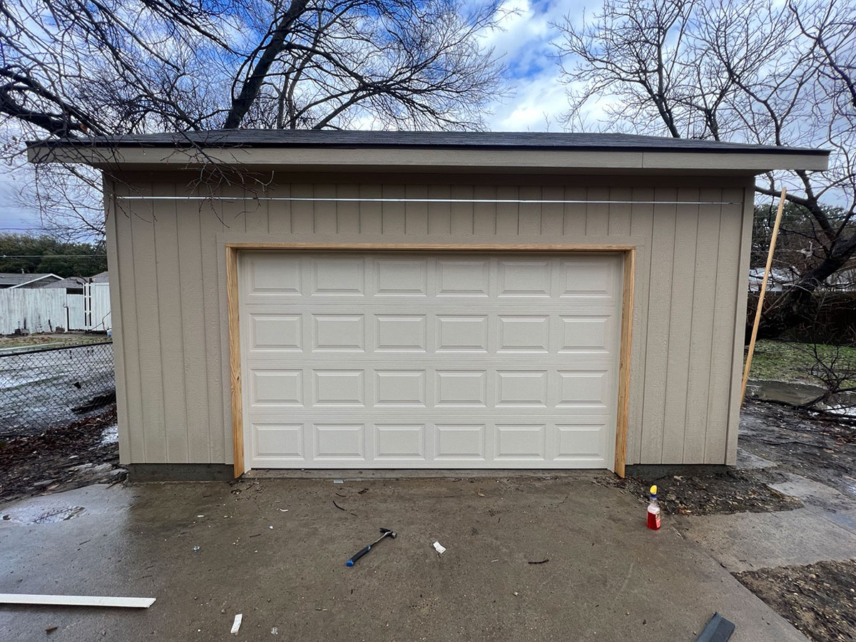 Walker-Garage-3 Completed garage rebuild in Richardson TX with new siding, roof, and garage doors by Old South Construction.